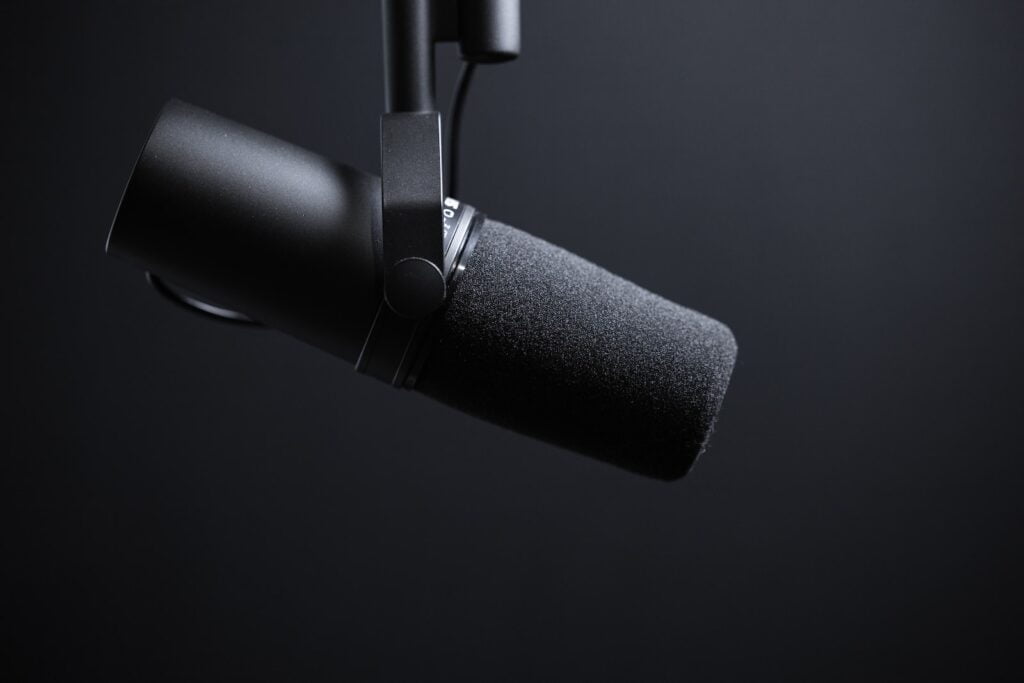 black and silver microphone with white background